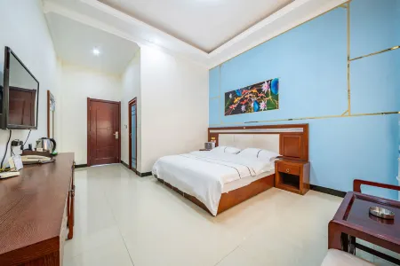 Yuanmou Aiweike Business Hotel Отели рядом с достопримечательностью «Liangshan Passenger Transport Terminal»