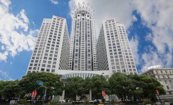 "A large urban building with the name ""McDonald's"" displayed prominently in front" at The Westin Bund Center Shanghai