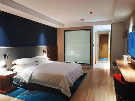 Gujing Junlai Hotel (Taihe Sports Center Branch) Отели в г. Тайхэ