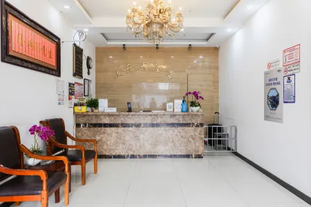 Huanle Hotel Отели рядом с достопримечательностью «Wansheng Rice Merchants»