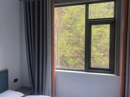 Yuchuan Yashiju Inn Отели рядом с достопримечательностью «Nanshan Bulao Valley Scenic Area»