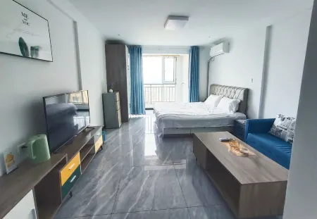 Orange Apartment Отели рядом со станцией Junan Railway Station