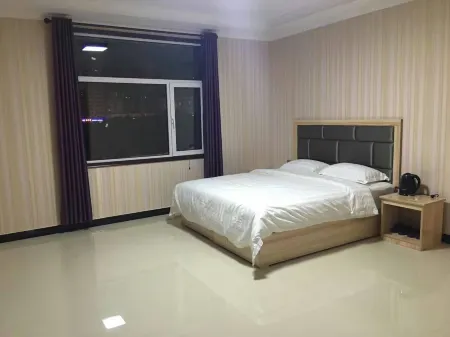 Yuzhong tucaizhu Business Hotel Отели рядом с достопримечательностью «Center Square»