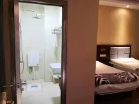 Huaning Ruiguang Business Hotel - Inns