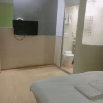 Wanyue Express Hotel (Xingyang Long-distance Bus Central Station)