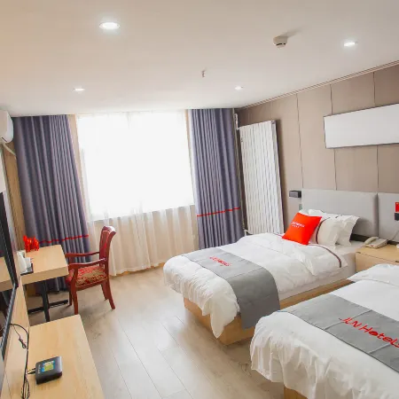 Junyi Hotel (Mengzhou Bus Station)