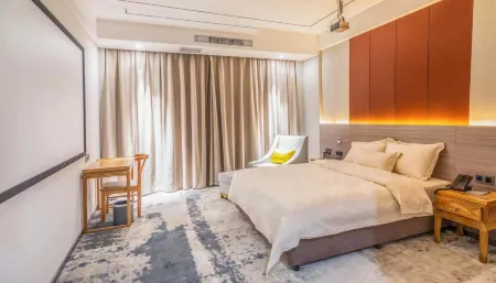 Riyuehu Mountain Hotel (Shangqiu South Railway Station) Отели рядом с достопримечательностью «Shangqiu Institute of Technology»