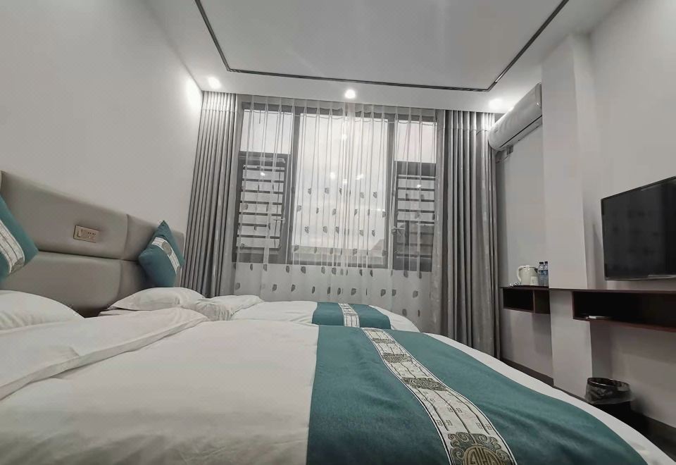 Xinyu Hotel 객실 내부 전경