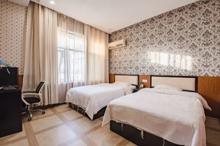 Minquan Shangzhai Express Hotel (Minquan Railway Station) Отели рядом с достопримечательностью «Minquan National Forest»