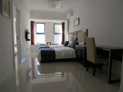 Guan County Hong Pu Traders Hotel
