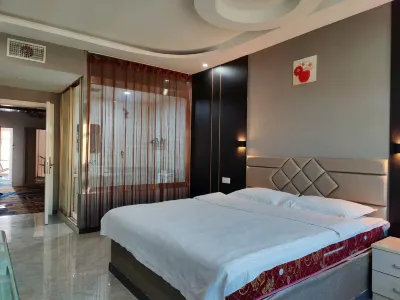 Keshan Jindun Hotel Отели в г. Кешань