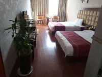 Xichang Shunda Business Hotel - إقامة ريفية