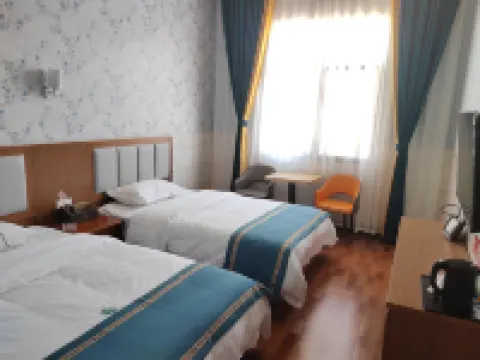 Linfeng Hotel Hoteles en Huize