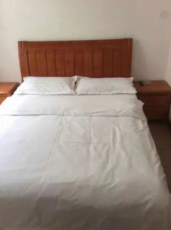 Yijia Station Отели в г. Сяоган