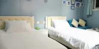 Qingdao Island Garden Hostel - 蓝色海洋传奇双胞胎室