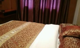 Songtao Xingyuan Business Hotel