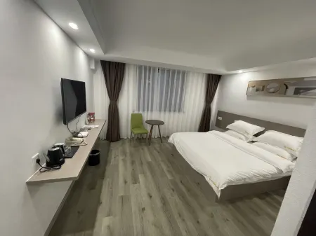 Guannan Qianxin Business Hotel Отели рядом с достопримечательностью «Er'langshen Culture Relics Park»