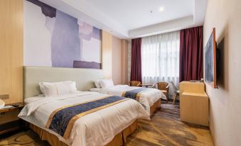 beds and a spacious table in the center at Hawaii International Hotel (Shenzhen International Convention and Exhibition Center)