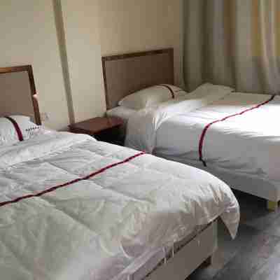 Huaiyuan Yulongwan Business Hotel Rooms