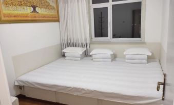 Benxi Huamu Hefu Warm Apartment