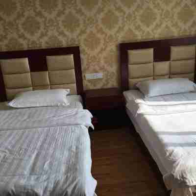 明光興源賓館 Rooms