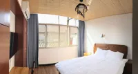 Xinchang Fangya Homestay - مطابخ