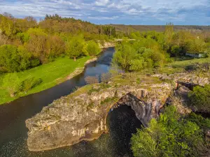 Natural stone arch on the river Vit