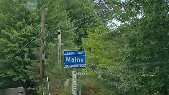 Maine State Line Sign