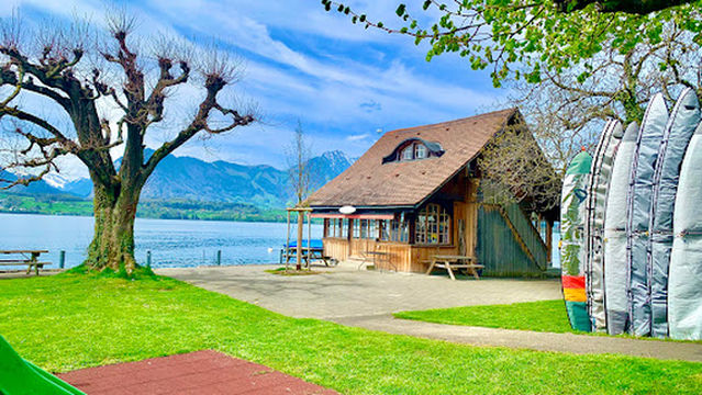 Badhuus du Lac Thunersee: Windsurf & Stand Up Paddle Schule, Surfclub, Clubcafé