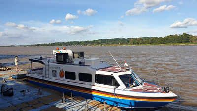 Boat dock boat crossing Mahakam Kumala Island