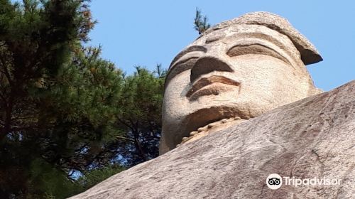 Rock-carved Standing Buddha