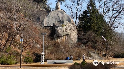 Rock-carved Standing Buddha