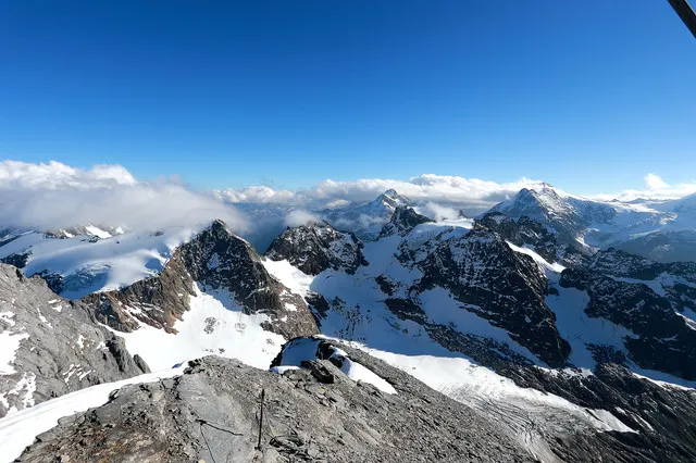 Gallop Among Towering Snowy Mountains with a Panoramic View of the Alps