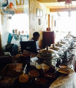 The Sitting Elephant - A Rooftop Restaurant Overlooking River Ganga