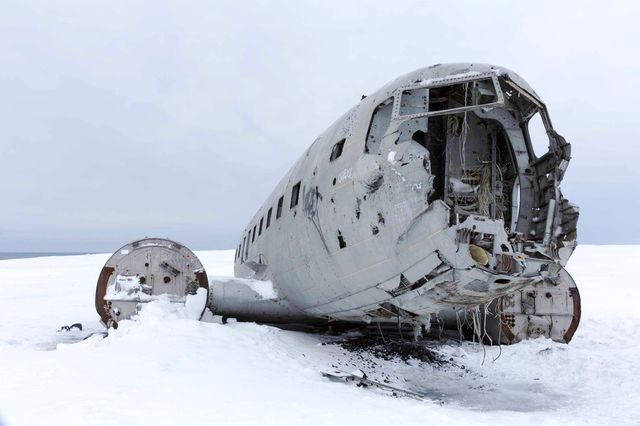 The wreckage of an airplane at the end of the world.