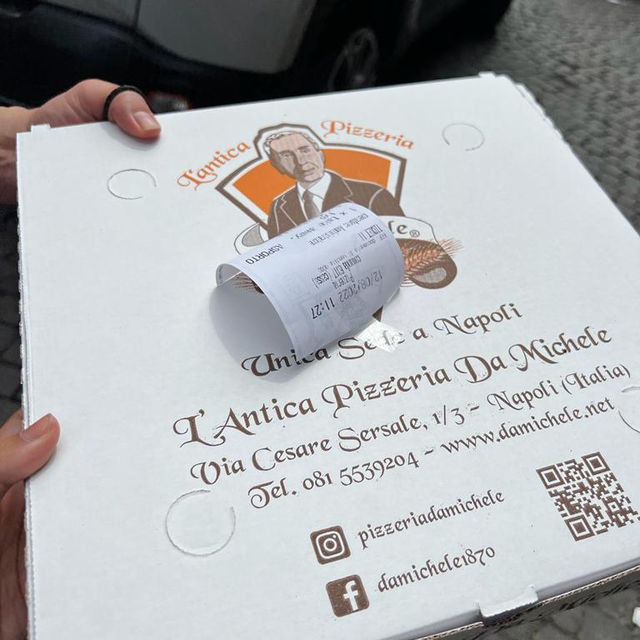 A sfogliatella and a box of pizza - Napoli