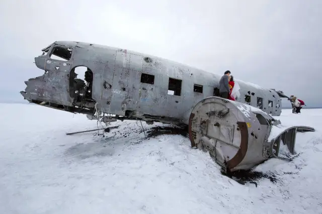 The wreckage of an airplane at the end of the world.