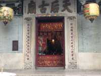 Historic temple with art work on the roof 