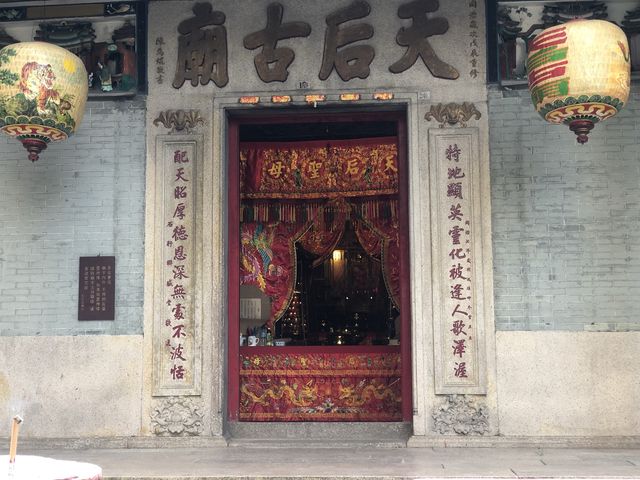 Historic temple with art work on the roof 