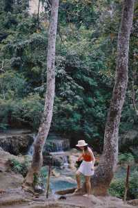 With a drone, see the panoramic view of Kuang Si Falls in Luang Prabang.