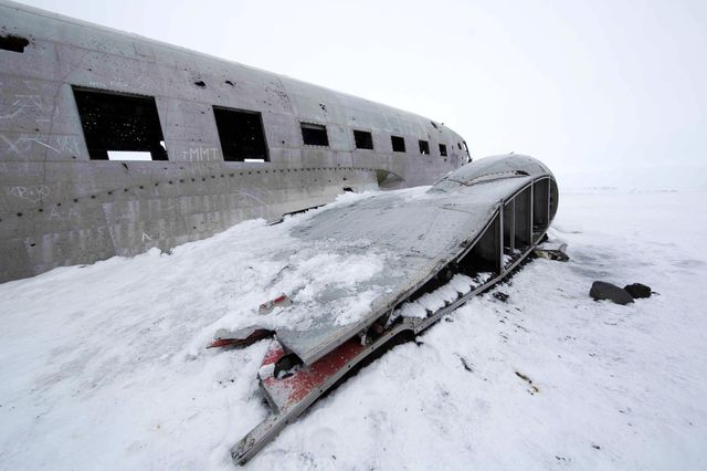 The wreckage of an airplane at the end of the world.