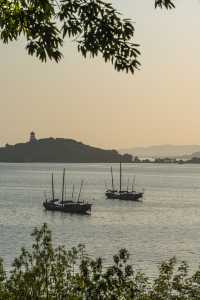 Fishing boats singing at dusk.