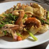 Must try fried curry seafood dish here 