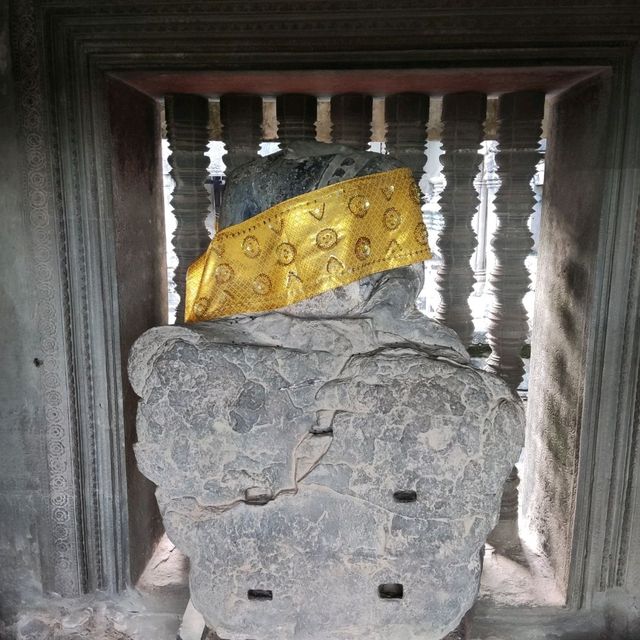 Climbing the tower of Angkor Wat