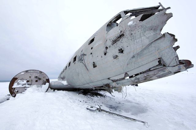 The wreckage of an airplane at the end of the world.