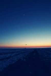 Hot air balloons flying all over the sky.