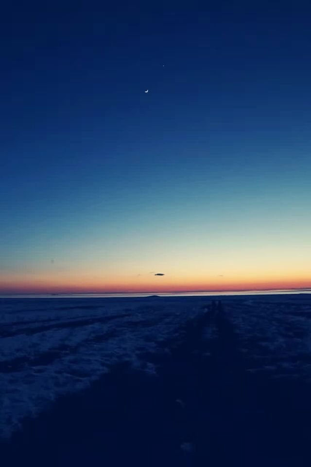 Hot air balloons flying all over the sky.