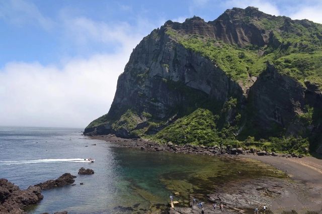 Another reason to travel to South Korea: check in at the Dragon Head Rock, a 2 million-year-old landmark on Jeju Island.