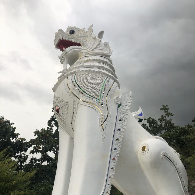 huge white Buddha overlooking the city of Pai