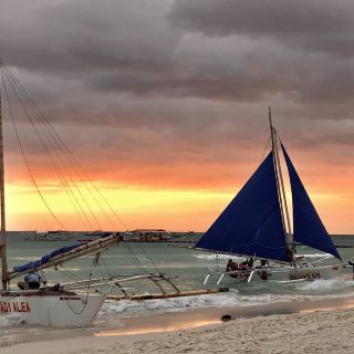 Emerald sea, red sunset, white beach
